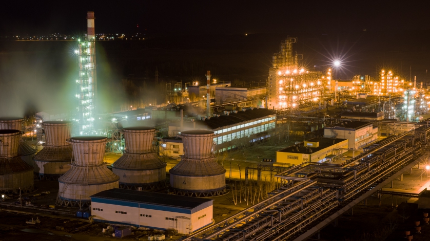 panorama of large chemical plant at night with light